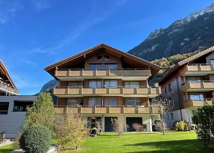 Romantic Swiss Alp Iseltwald With Lake & Mountains
