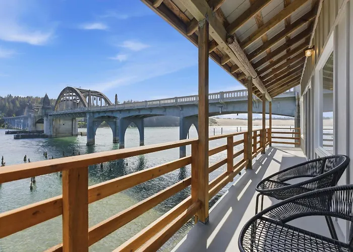 Incredible Riverfront Oasis With Wraparound Deck & Cozy Interior